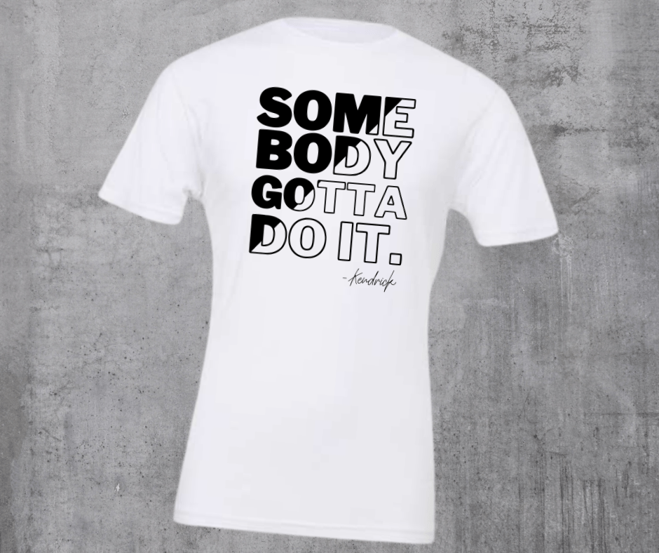 SOME BODY GOTTA DO IT Kendrick (BLACK INK) White Tshirt - Wholesale - The Red Rival